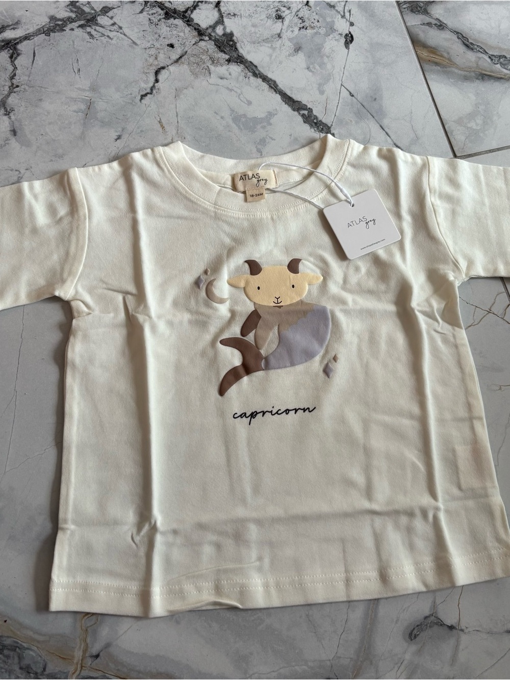 Baby Cream Capricorn Graphic Tee